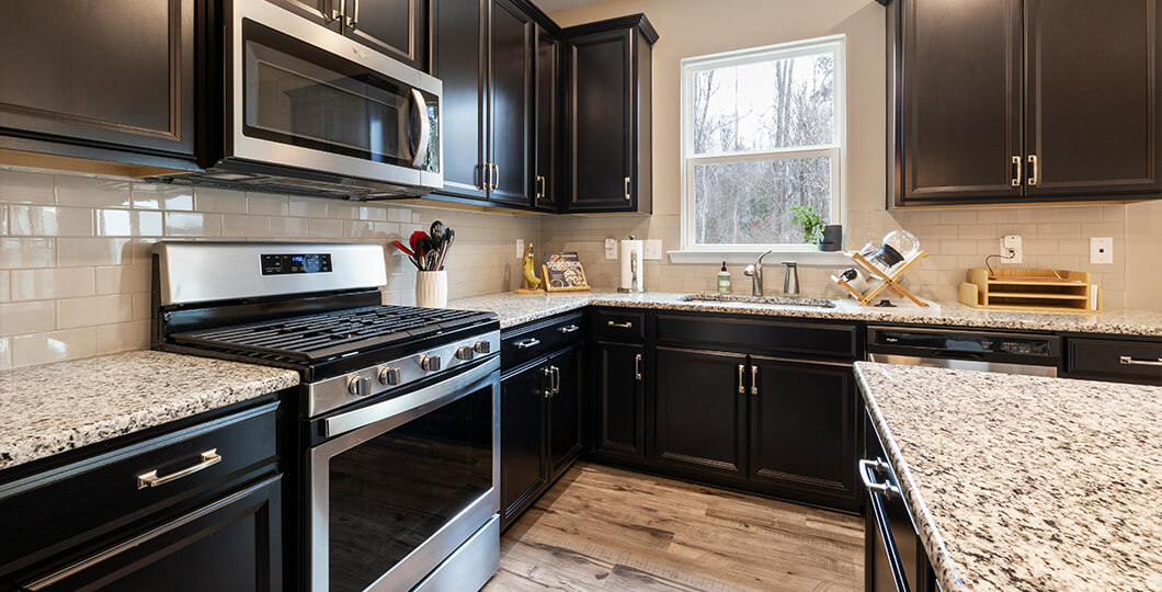 Kitchen with dark cabinets