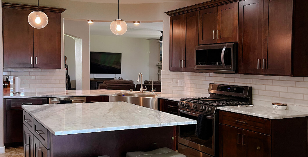 High contrast with light countertops and dark cabinetry